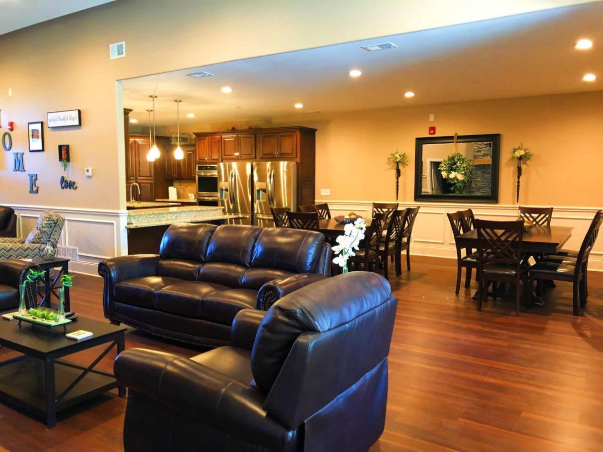 Spacious open floor plan with a cozy living room, modern kitchen, and dining area.