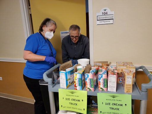 Volunteers assisting with food distribution at a community service event.