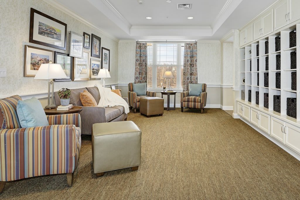 A cozy living room with comfortable seating and elegant decor.
