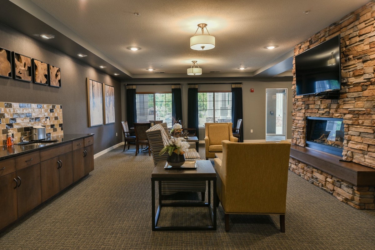 A cozy and modern living room with elegant furniture and ambient lighting.
