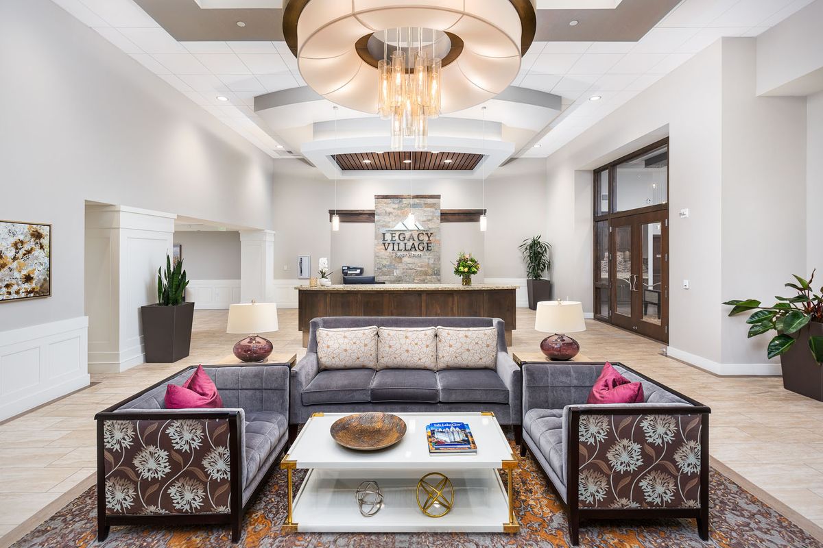 A modern hotel lobby with elegant furnishings and a welcoming reception area.