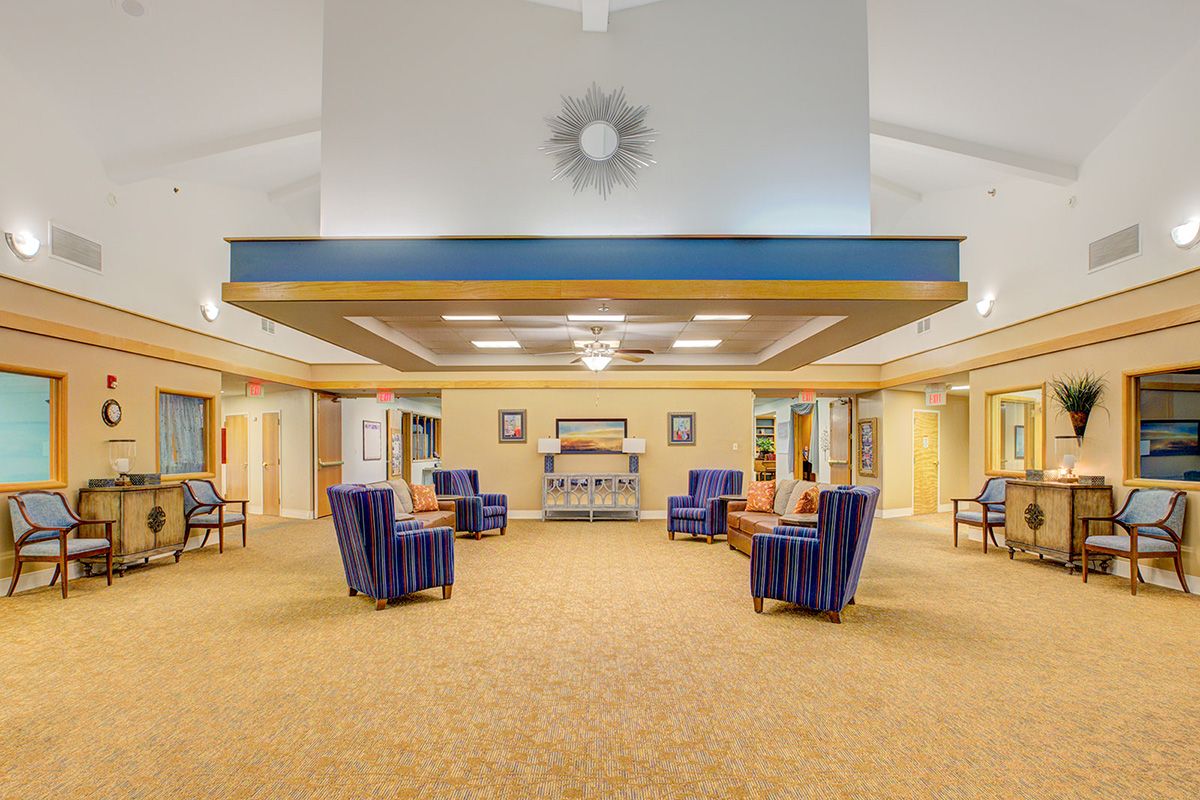 A spacious lobby with comfortable seating arrangements and decorative lighting.