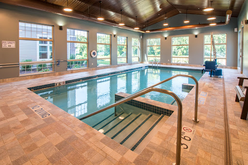 A serene indoor swimming pool showcasing a modern design, perfect for relaxation and fitness.