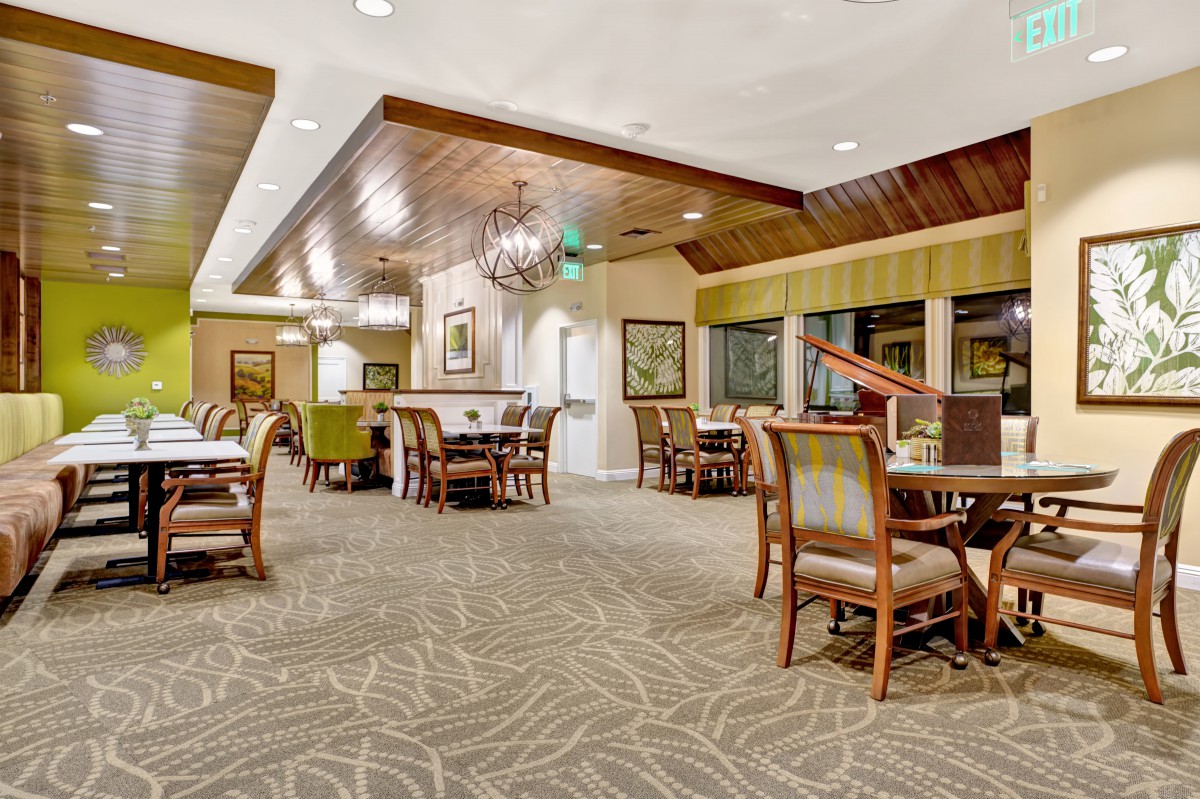Elegant dining area with classic furnishings and warm lighting.