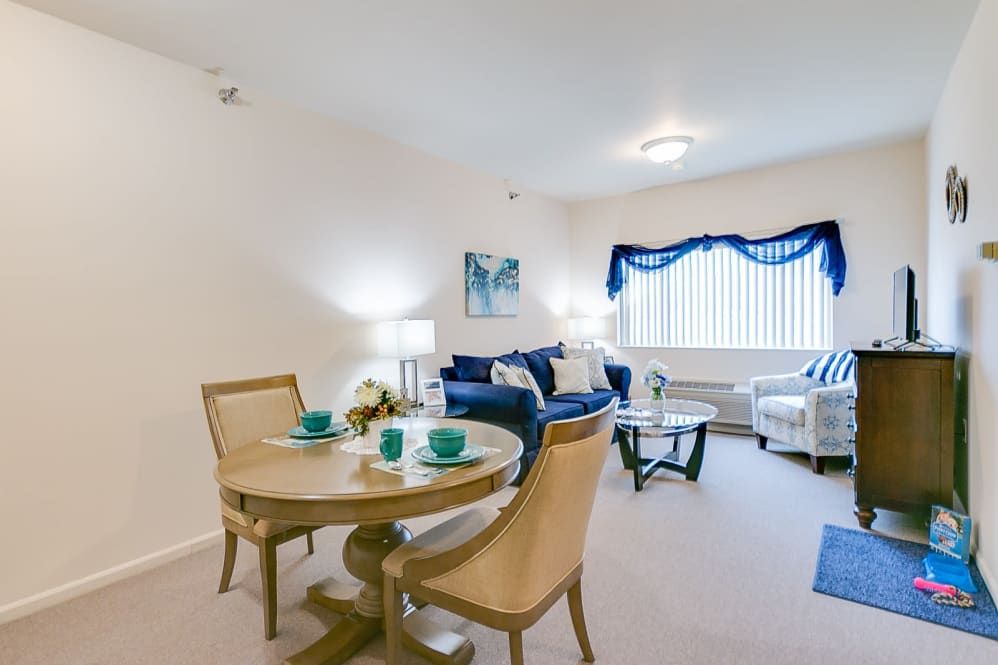 A cozy living and dining area with stylish furniture and decor.