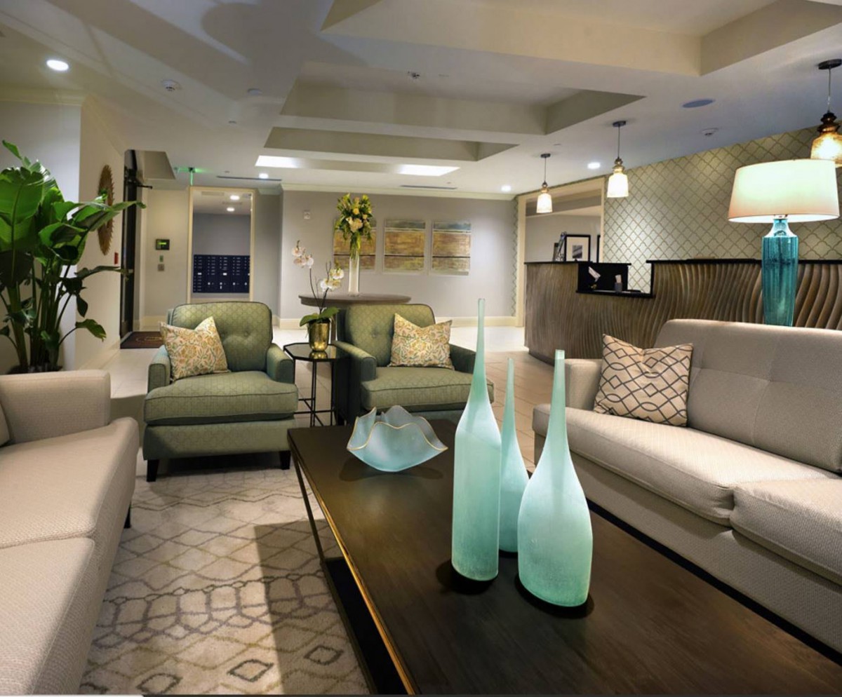 A modern living room with stylish furniture and decor, featuring comfortable seating and soft ambient lighting.