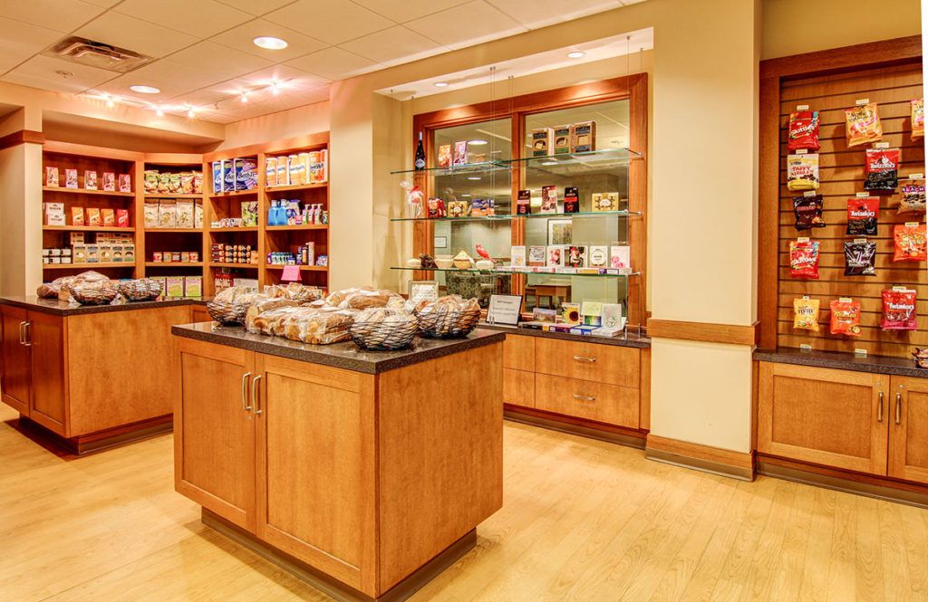 A well-organized store interior featuring shelves stocked with various products.