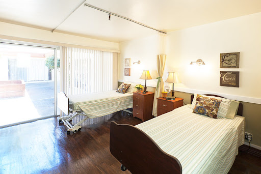 A serene hospital room with two beds, designed for patient comfort and care.