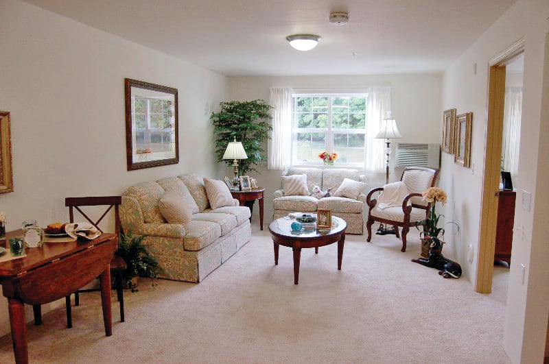 A cozy living room with elegant furniture and tasteful decor.