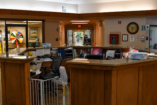 A view of a reception area featuring desks, computers, and an inviting workspace.