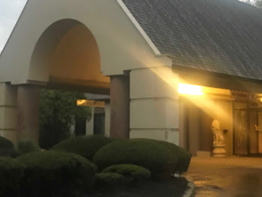 An inviting entrance to a building illuminated by soft evening light.