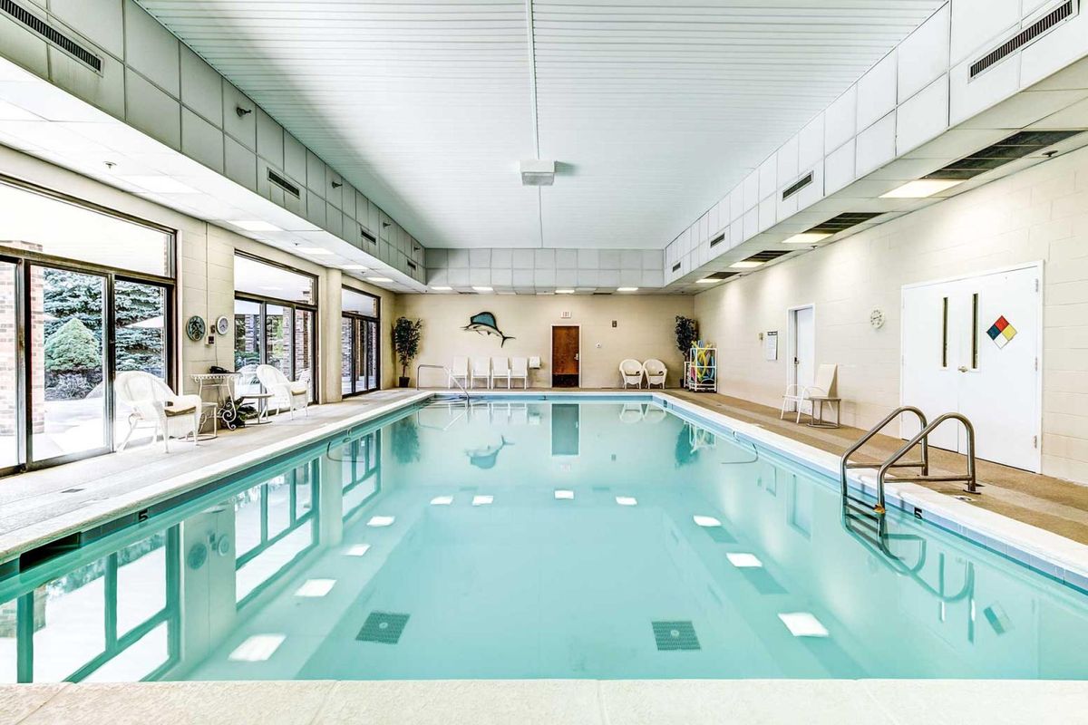 A luxurious indoor swimming pool with clean, inviting water and relaxing amenities.