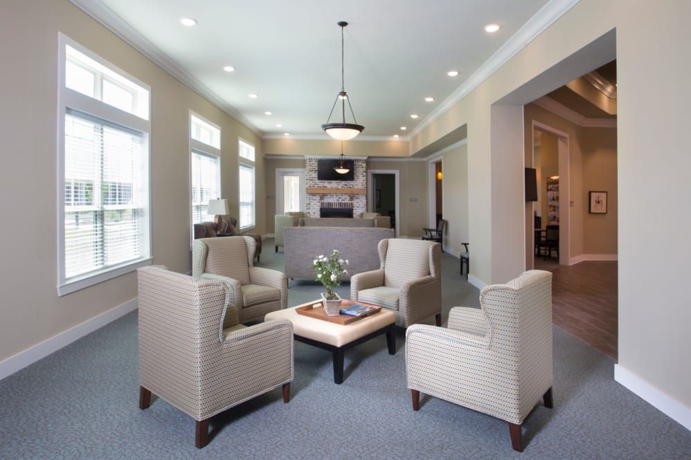 A modern living room with comfortable seating and an open kitchen layout.