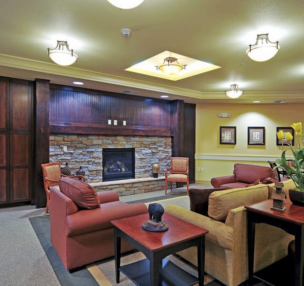 A cozy living room with comfortable seating and a fireplace.