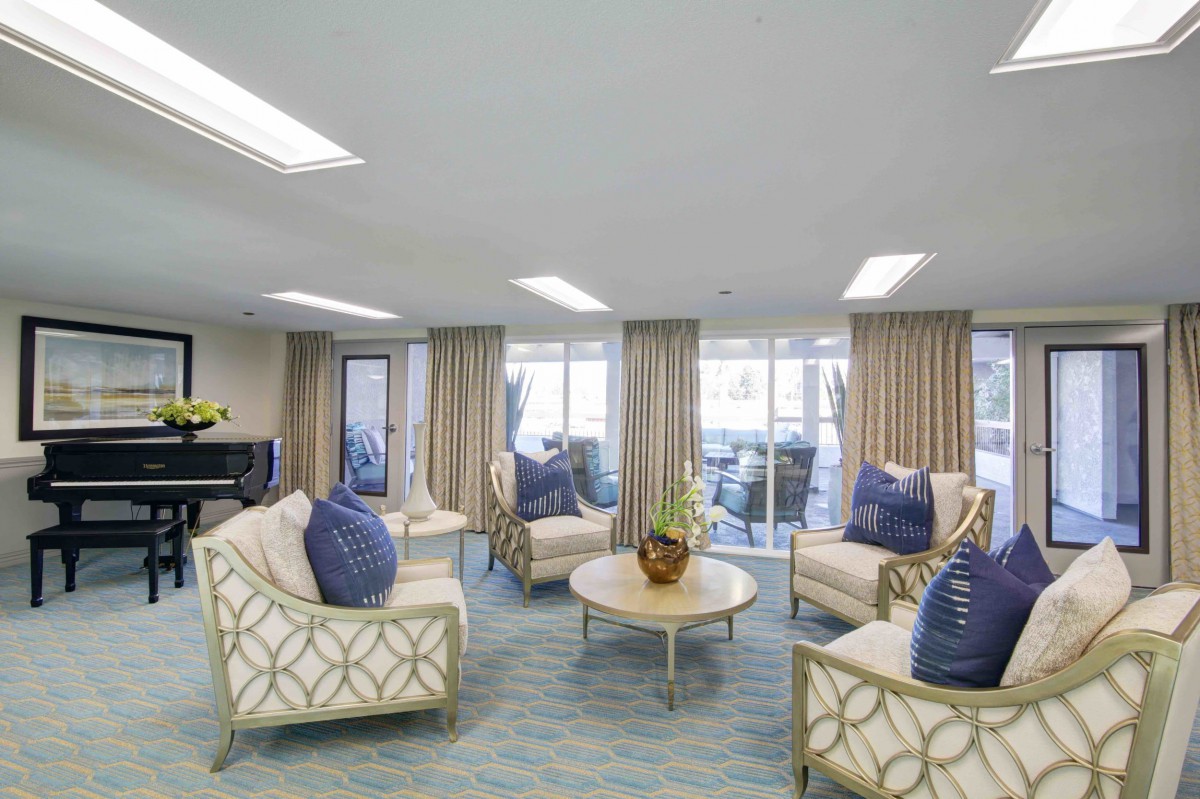 A modern living room with comfortable seating and elegant decor.