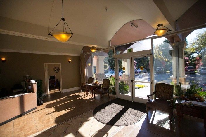 A well-lit lobby with comfortable seating and large windows.