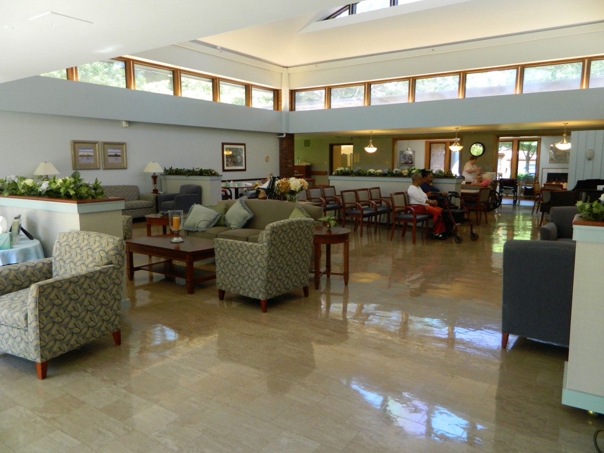 A spacious and modern lobby with comfortable seating and large windows.