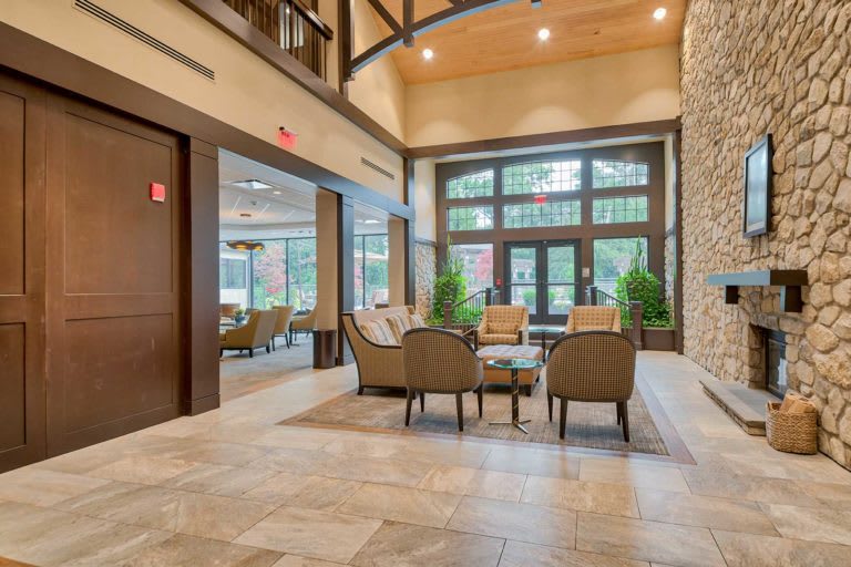 A modern and spacious lobby with comfortable seating and large windows.