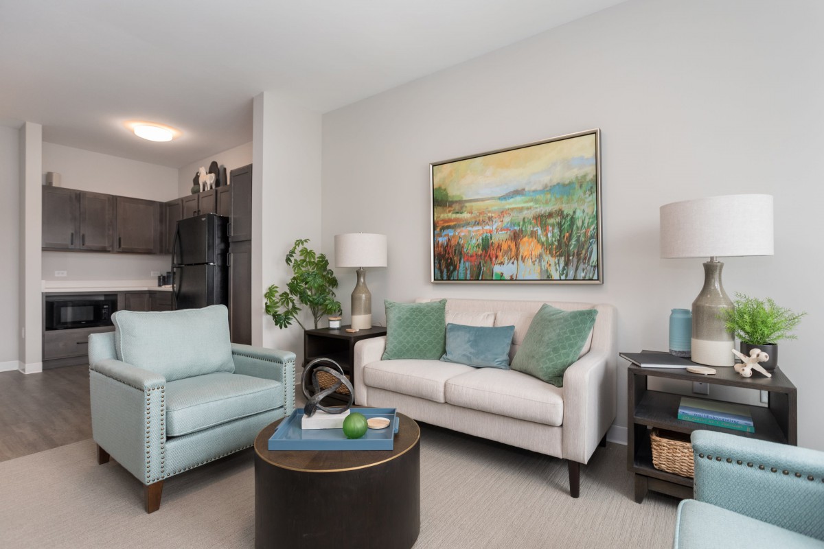 A modern living room with comfortable seating and stylish decor.