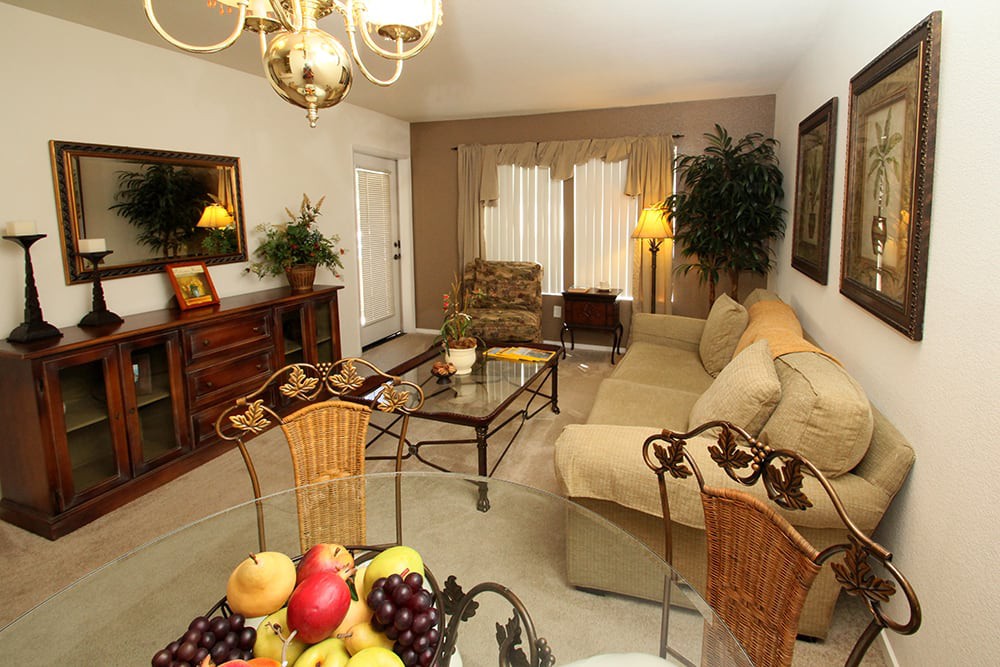 A cozy living room with elegant furniture and warm lighting.