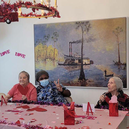 Seniors enjoying a festive Valentine's Day celebration together.