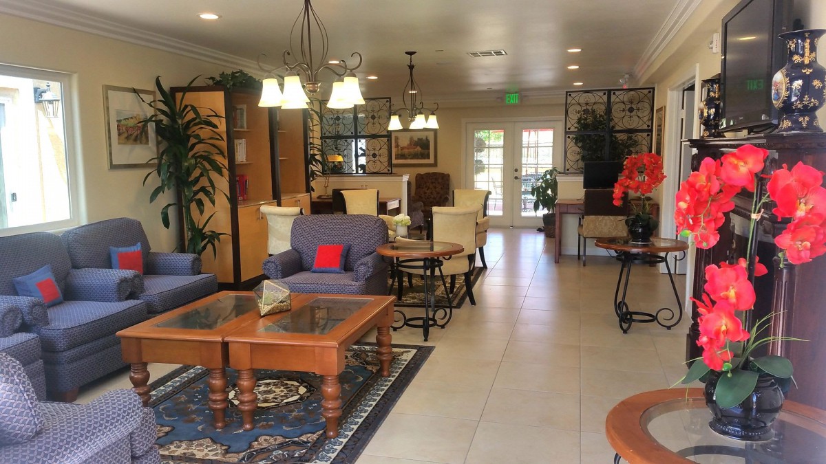 A cozy living room with comfortable seating and elegant decor.