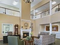 A cozy living room with a fireplace and comfortable seating.