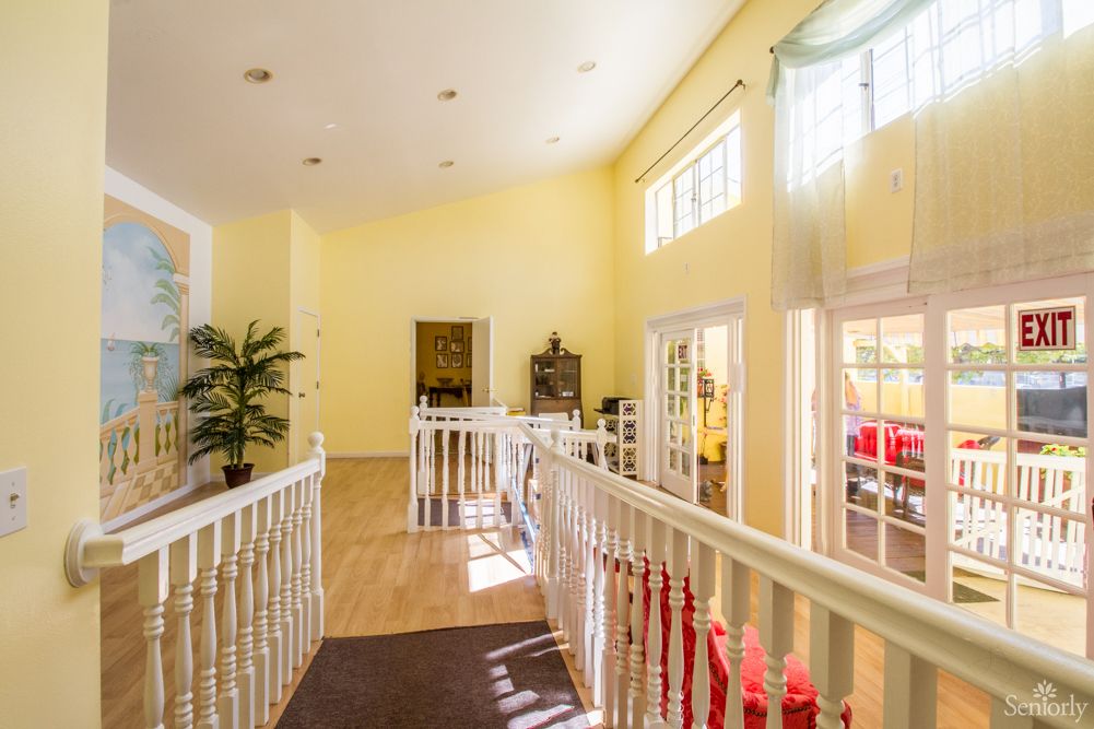 A bright hallway with large windows and decorative elements.