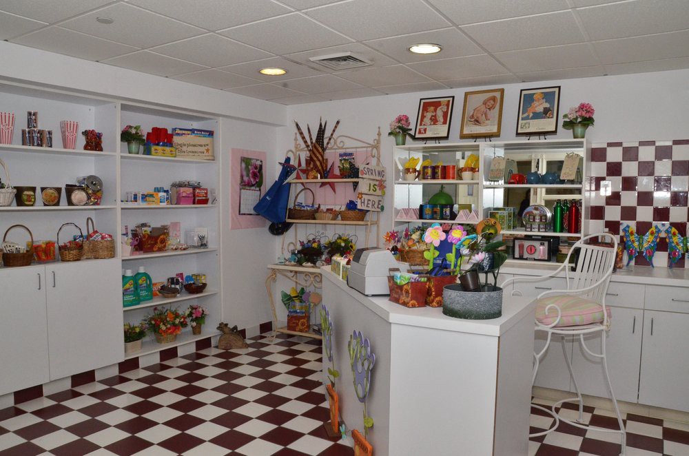 A vibrant store interior with shelves stocked with various merchandise and a checkered floor.