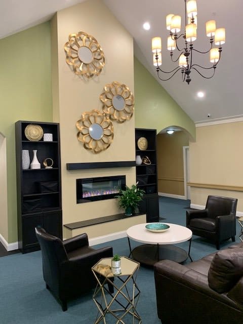 A modern living room with stylish decor and comfortable seating.