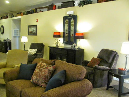 A cozy living room featuring a comfortable sofa, recliner, and tasteful decor.