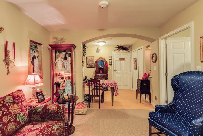 A cozy living room adorned with vibrant furniture and decorative pieces.