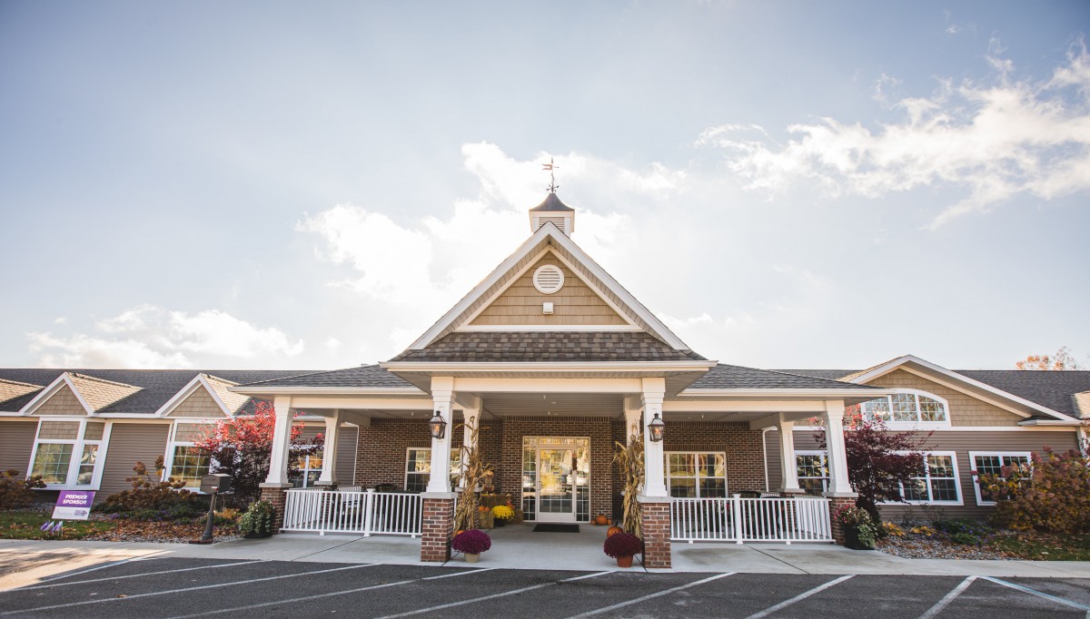 A charming building with a peaked roof and inviting entrance under a clear sky.