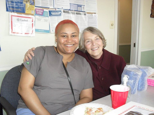 Two friends enjoying a moment together in a relaxed indoor environment.