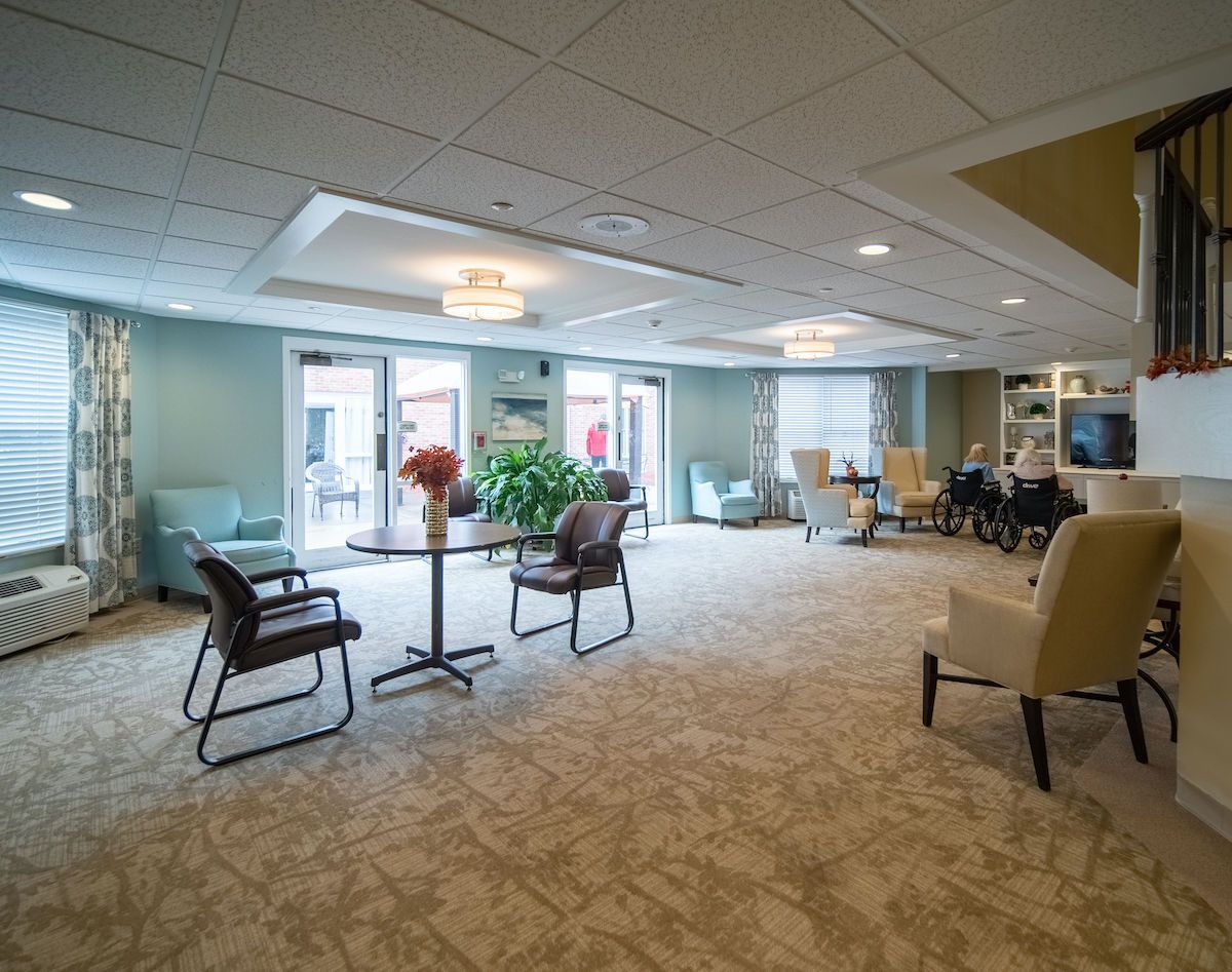 A spacious and well-lit lobby with comfortable seating and large windows.