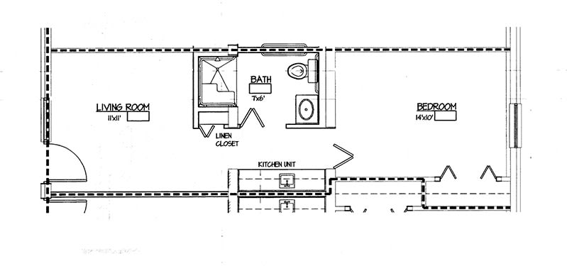 A section of a floor plan showing a bathroom, closet, and part of the kitchen layout.