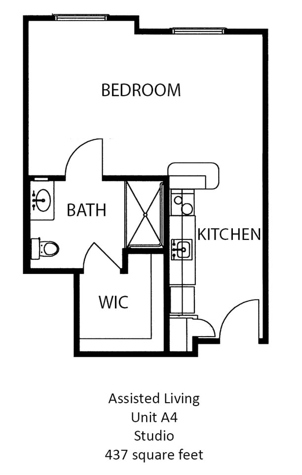 Floor plan of a one-bedroom apartment featuring a kitchen, bathroom, and walk-in closet.