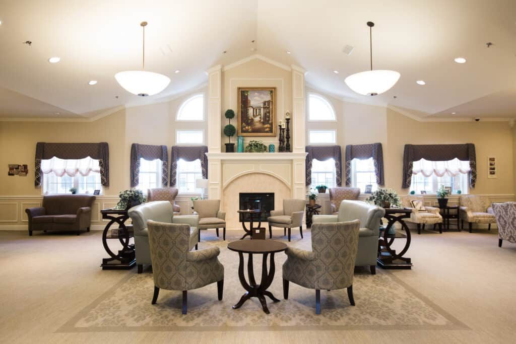 Elegant living room with a central fireplace and comfortable seating arrangement.