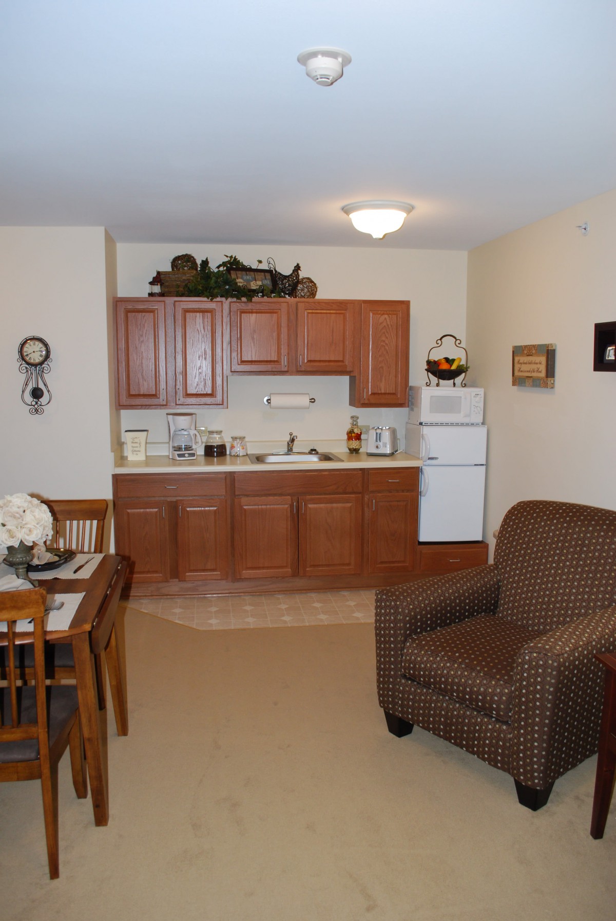A cozy apartment interior with a kitchen and living area.