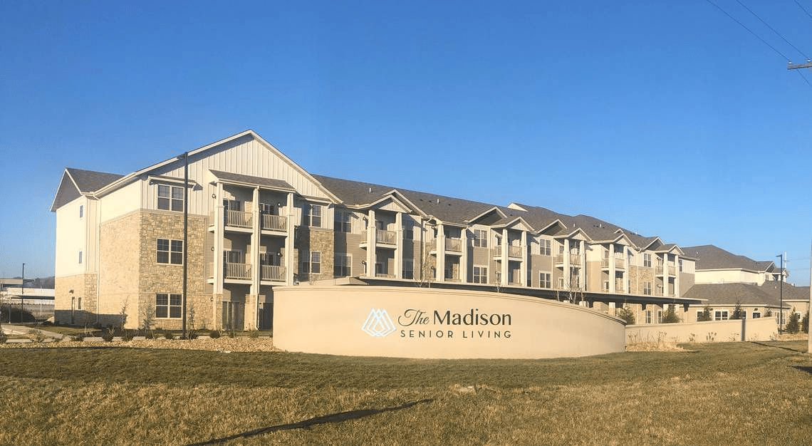 The Madison Senior Living complex on a clear day.