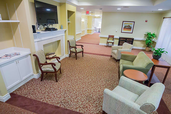 A cozy living room with comfortable seating and a television.