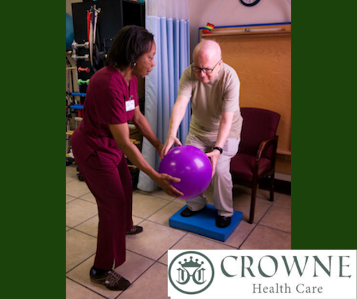A healthcare professional assists a patient during a physical therapy session, focusing on balance and mobility.