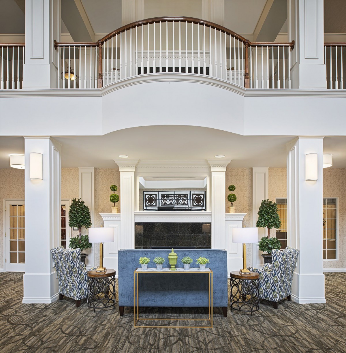 A modern and luxurious lobby interior with elegant furniture and architectural details.