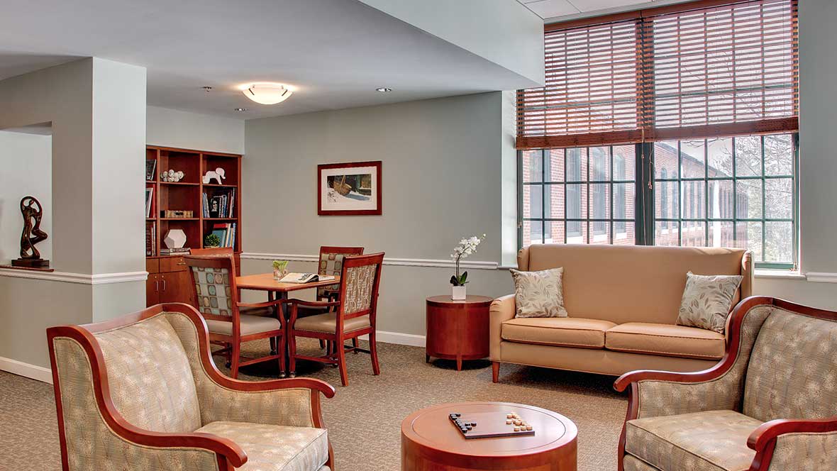 A well-furnished living room with comfortable seating and natural light.
