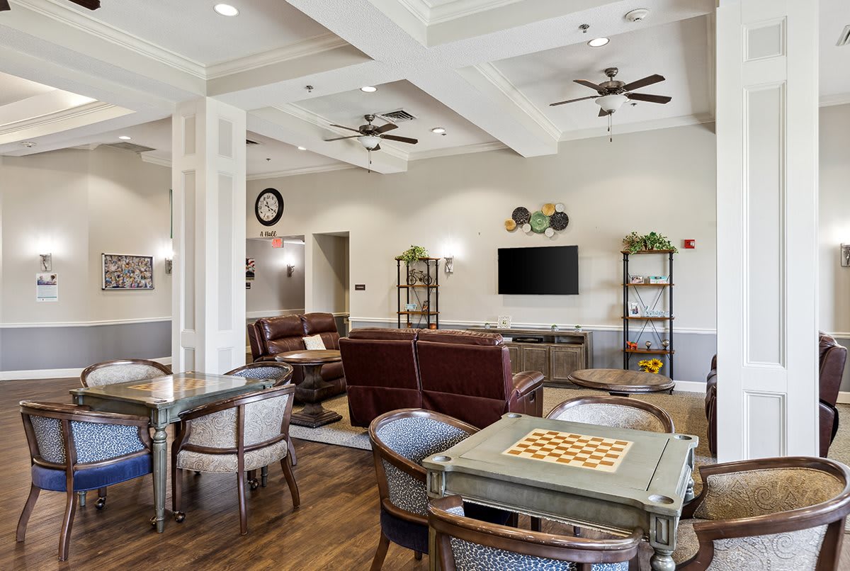 A cozy living room with comfortable seating and a TV area.