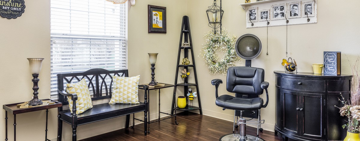 A cozy salon interior with stylish decor and seating.