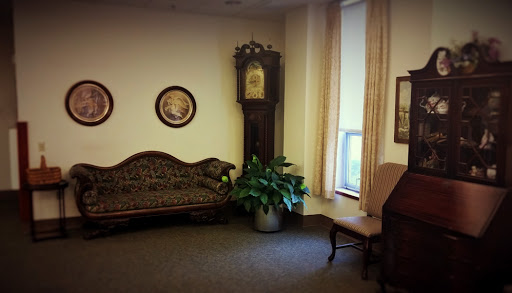 A cozy corner of a room featuring vintage furniture and decor.