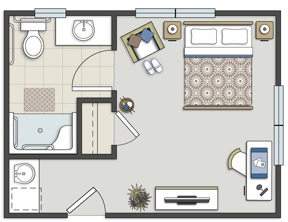 A floor plan showing a bedroom and bathroom layout with furniture and fixtures.