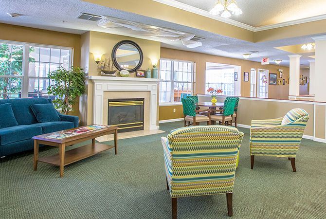 A cozy living room with a fireplace and comfortable seating.
