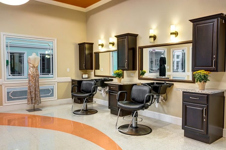 A modern hair salon with stylish chairs and large mirrors.
